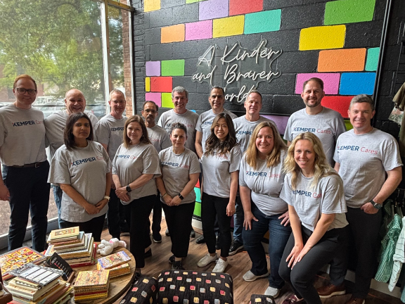 Kemper Cares volunteers gather at a community event