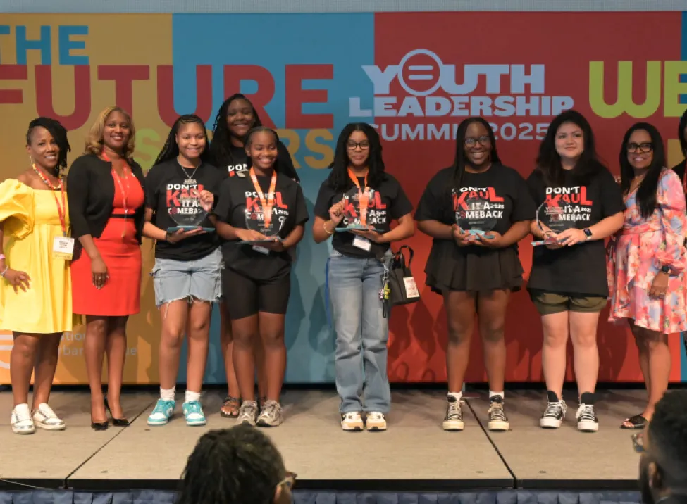 Youth participants and community leaders gather on stage at the 2025 Youth Leadership Summit