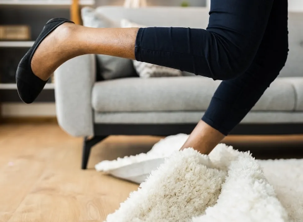 Woman falling on carpet